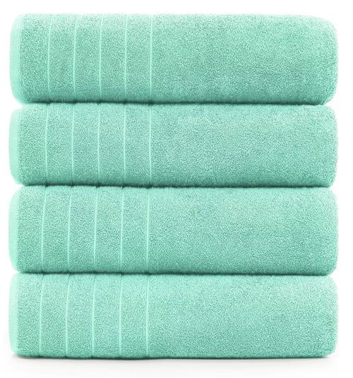 Extra-large bath sheet measuring 85 x 165 cm displayed on a bed